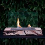 Ecological solid walnut wood fireplace with light bark